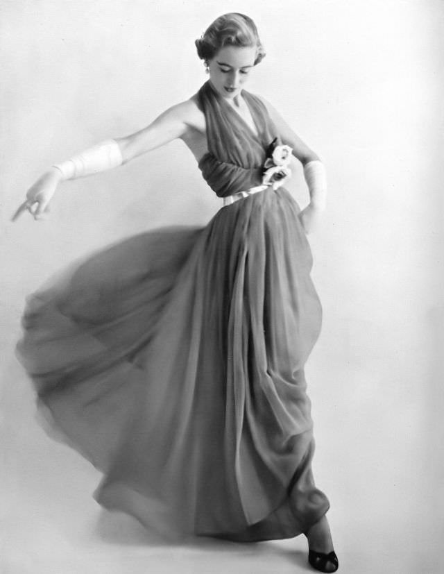 Pat O'Reilly in a cherry-colored silk chiffon dance-dress by Frank Usher, Harper's Bazaar UK, December 1950.