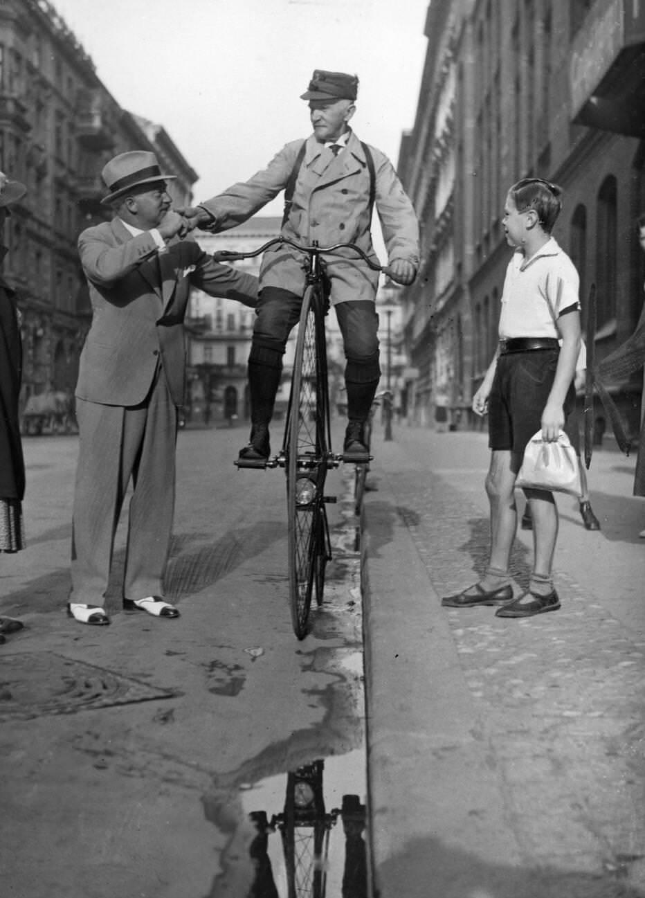 Victorian-dressed man on a penny-farthing, Cambridge, June 1947.