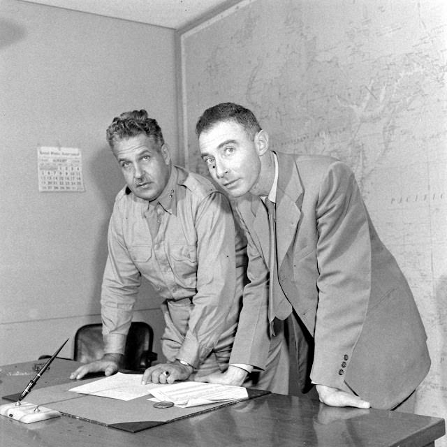 General Leslie Groves and J. Robert Oppenheimer, key figures in the first atomic bomb development, 1945.