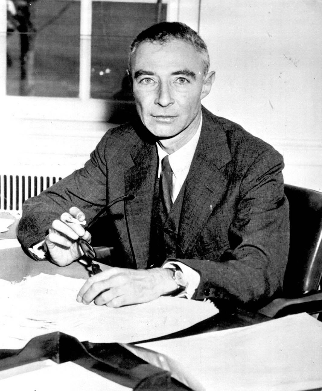 Dr. J. Robert Oppenheimer at his desk, discussing his barring from atomic secrets, June 2, 1954.