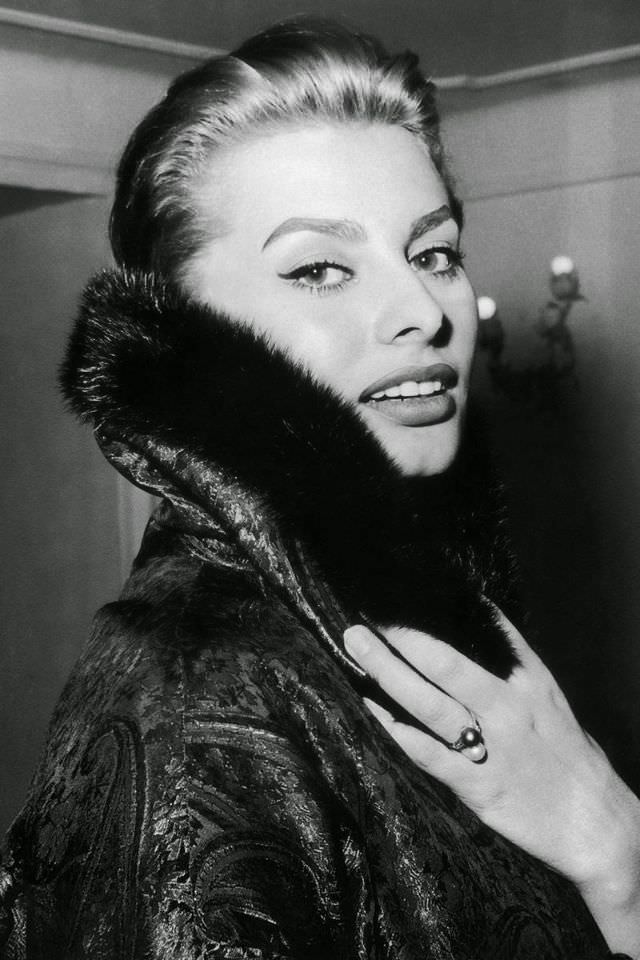Sophia Loren wearing a Christian Dior brocade coat, February 1956.