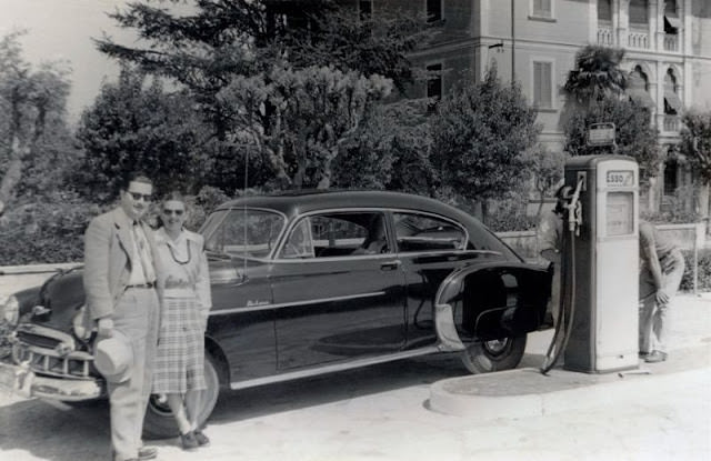 Couple with a 1949 Chevrolet Fleetline Deluxe, Italy, circa 1949.