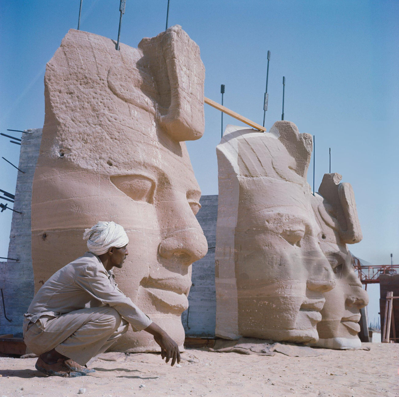 Stone heads of Pharaoh Ramesses II's statues at Abu Simbel being disassembled in 1964 for relocation due to Nile flooding from the Aswan High Dam.