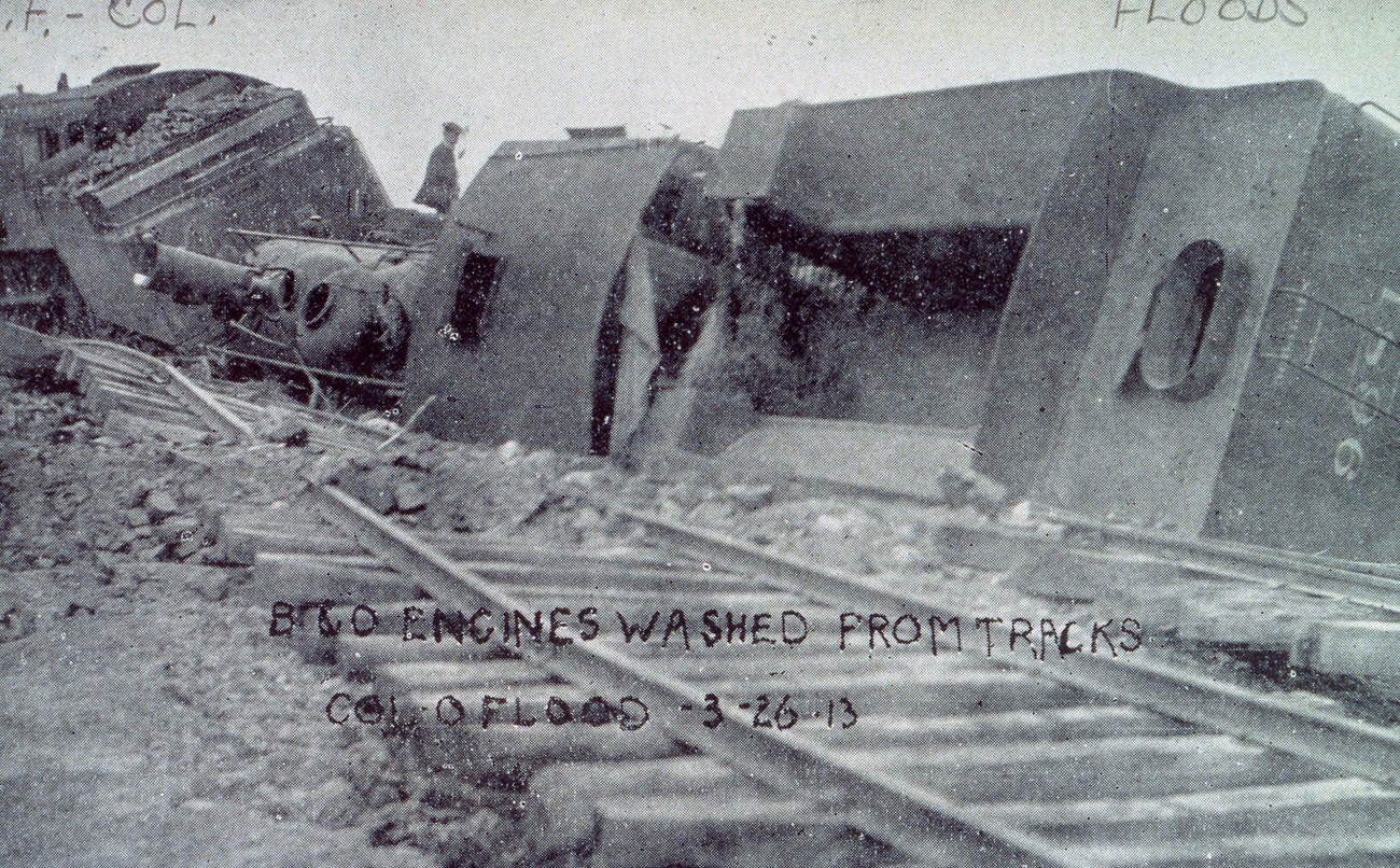 Photograph of Baltimore and Ohio Railroad locomotives overturned by flood waters, March 26, 1913.
