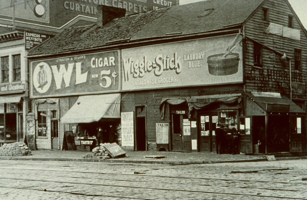C. M. Hubbard Livery on High and Cherry Streets, business location 1891-1896, photo showing Swan Tavern, later Franklin House, demolished October 27, 1912, Circa 1891