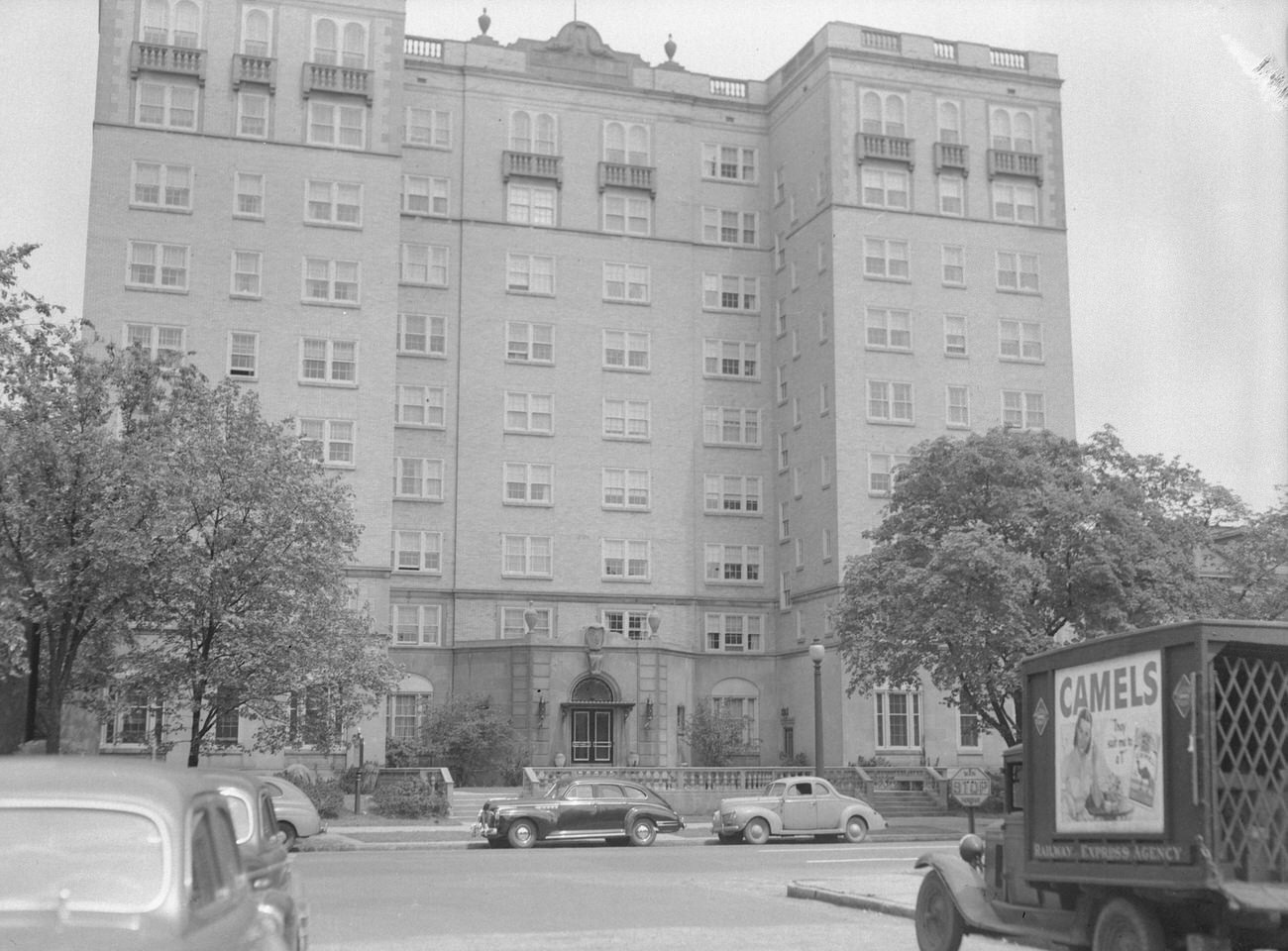 Cambridge Arms Apartments, with Camel cigarette truck, built in 1928, listed on National Register of Historic Places in 1986 but removed in 1987, restored in 2005, Circa 1948.