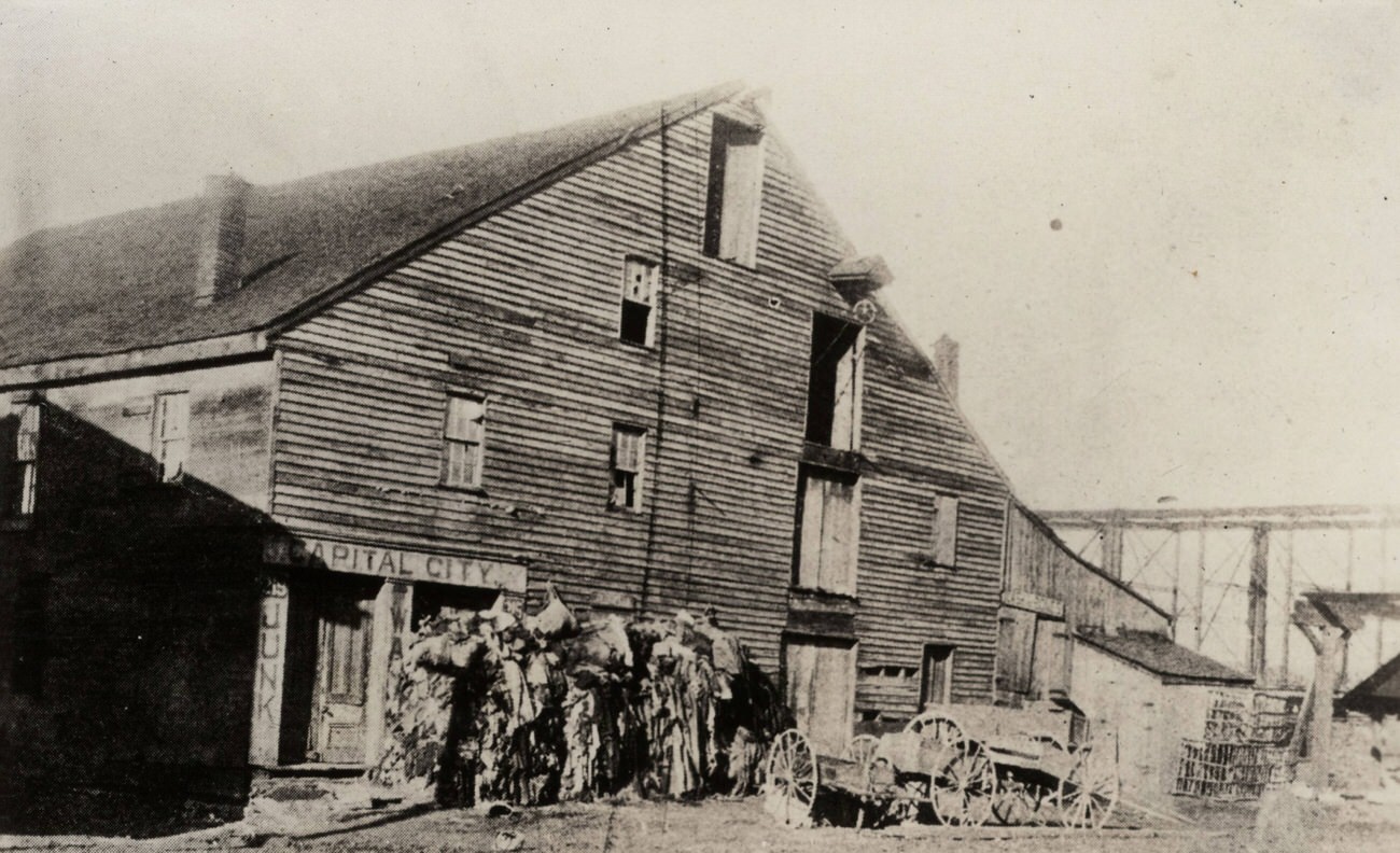 Canal Boat Warehouse building, used for merchandise shipping in the 1830s, later Capital City Junk, 1898.