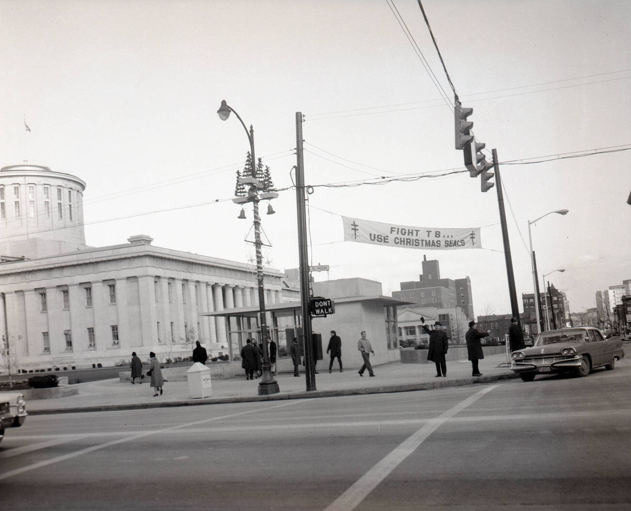 Christmas Seals banner near Ohio Statehouse during 1965 Christmas Seal campaign, activities of the Breathing Association, 1965.