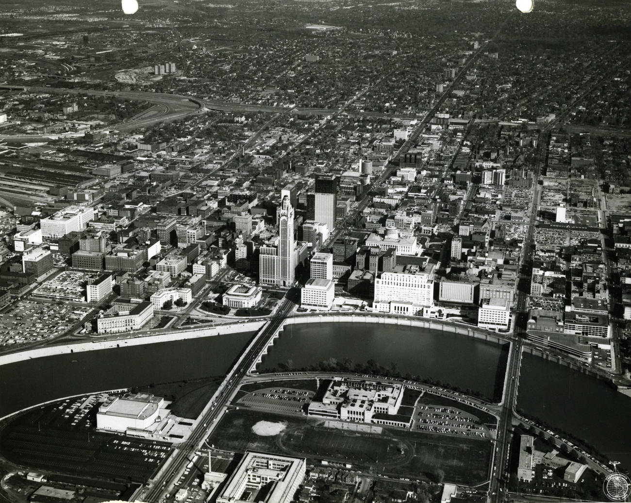 Civic Center looking east across Scioto River with Broad St Bridge in center, featuring Veterans Administration building and Veterans Memorial Auditorium, October 27, 1965.