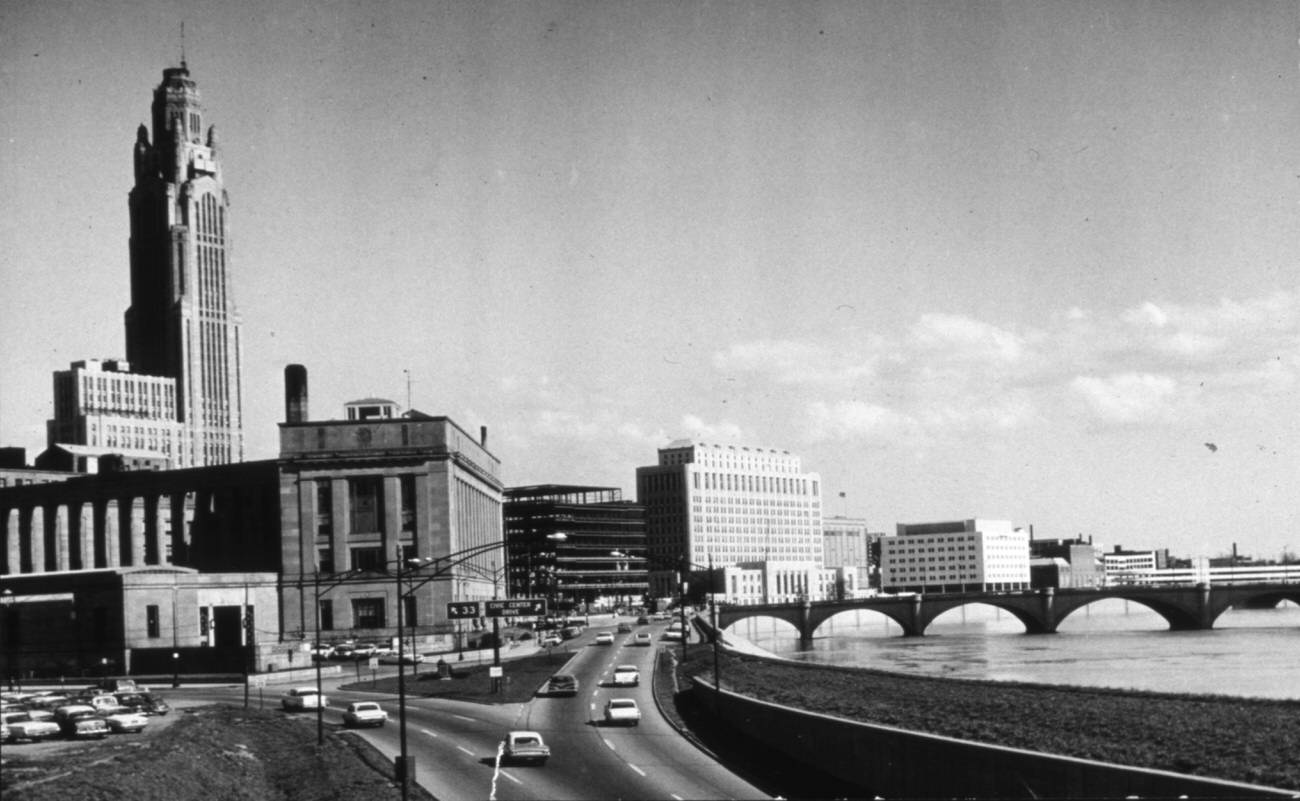 Civic Center looking south from Lafayette Street, showing afternoon traffic and the Federal Building, 1964.