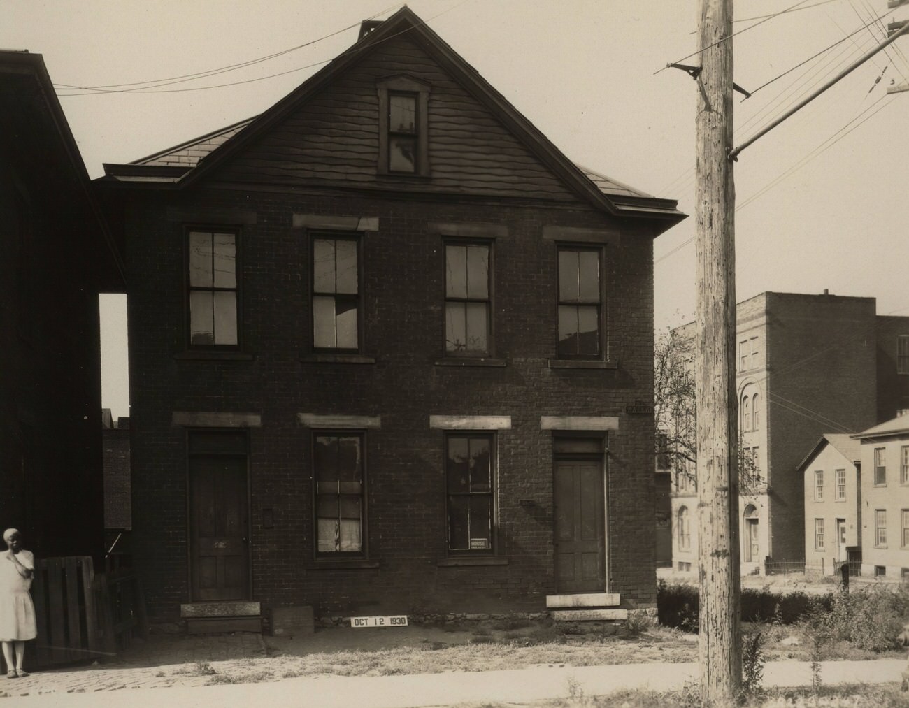 Brick double occupancy dwelling on Water and Randolph Streets, southwest corner, photograph from October 12, 1930.