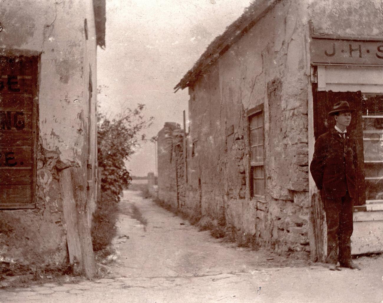 Conn Baker photographed by an old building in St. Augustine, Florida, May 17, 1896.