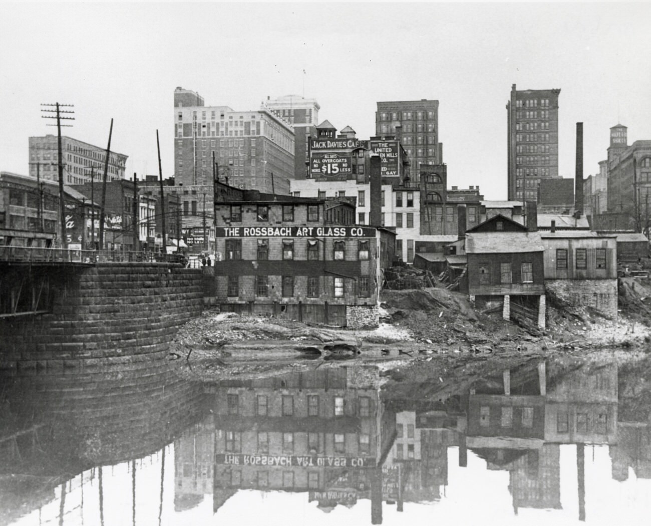 Downtown Columbus slum area on east bank of the Scioto River, view of Broad Street Bridge, 1916.