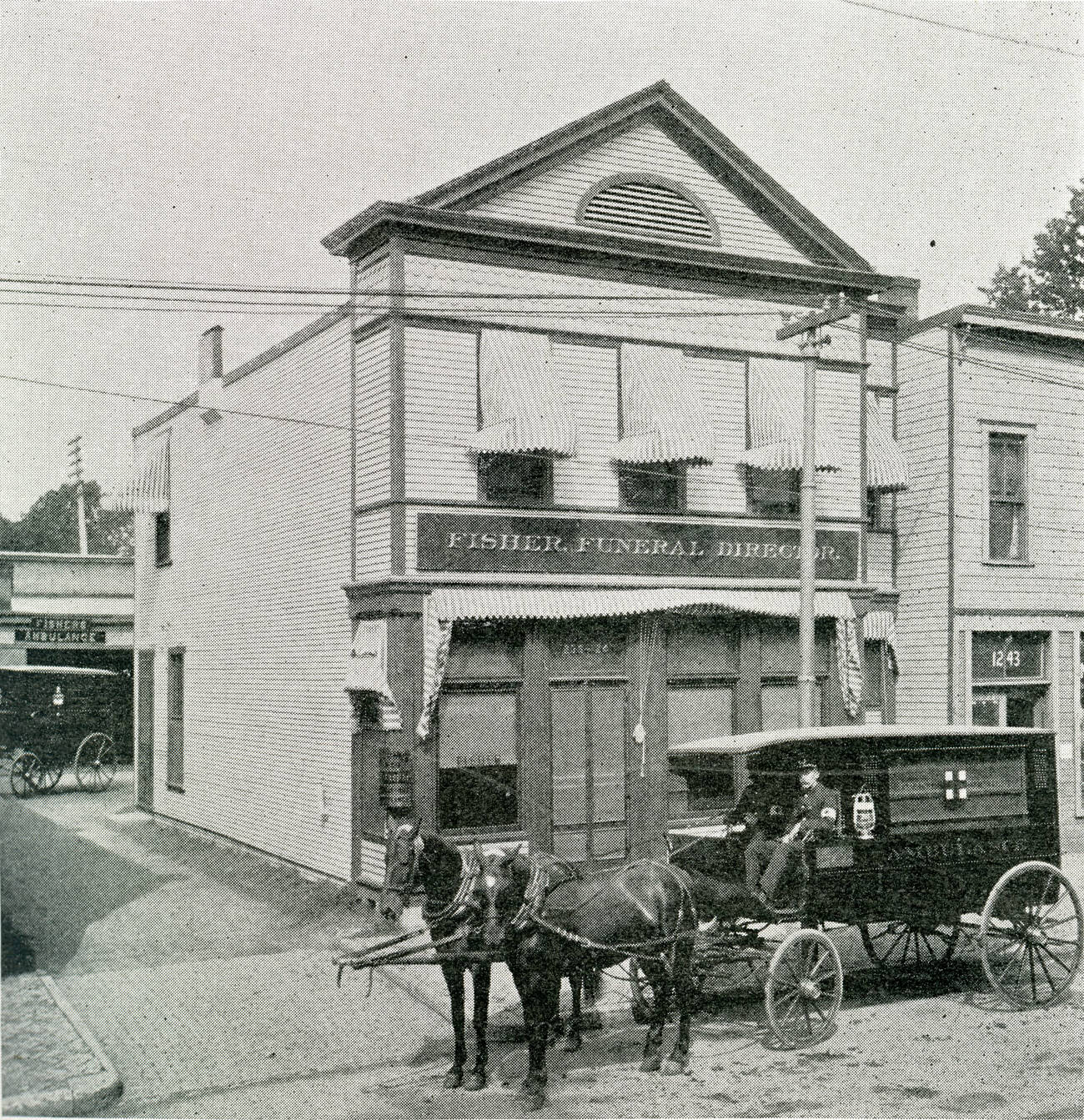 Edward F. Fisher & Company, funeral directors and ambulance service, established 1870, out of business 1961. Circa 1901.