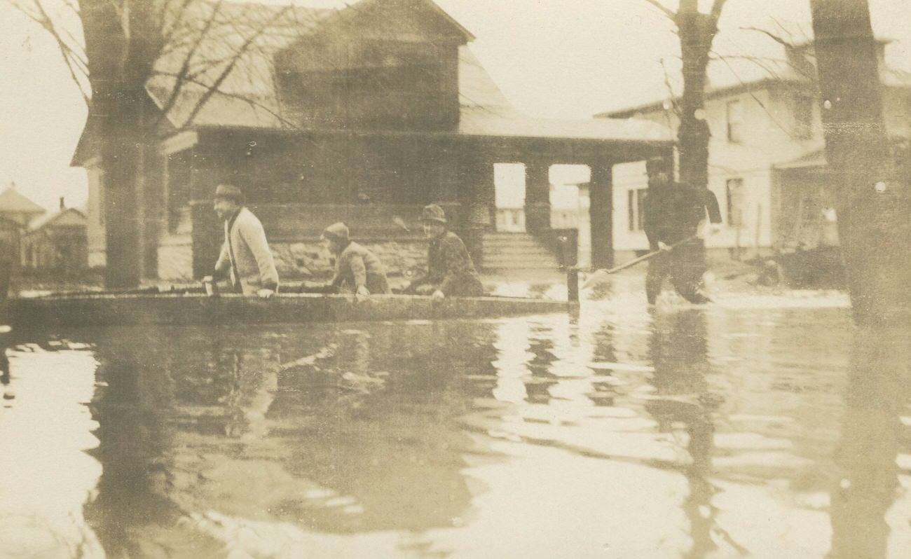 Flooded street scene with house and boat, Columbus, 1913.
