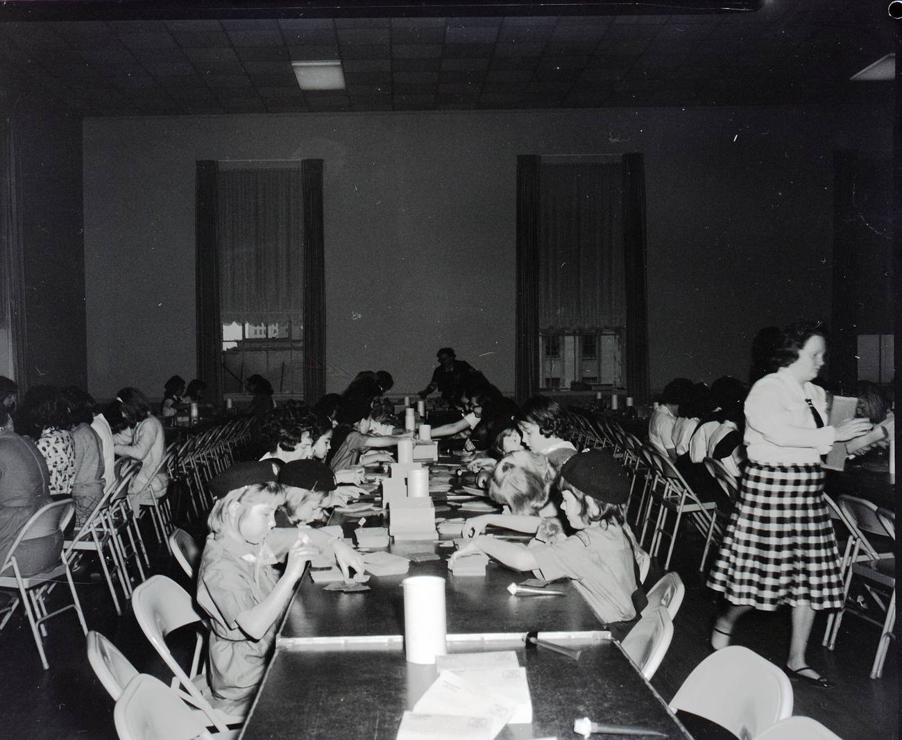 Girl Scouts volunteering during 1965 Christmas Seal Campaign, part of tuberculosis prevention efforts, 1965.