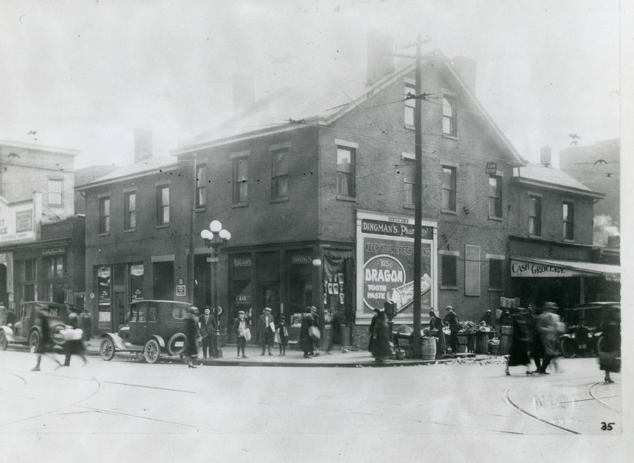 Harry Dingman Drug Store at 165 East State Street and Simon Josephson Fruits at 108 South 4th Street, 1910s