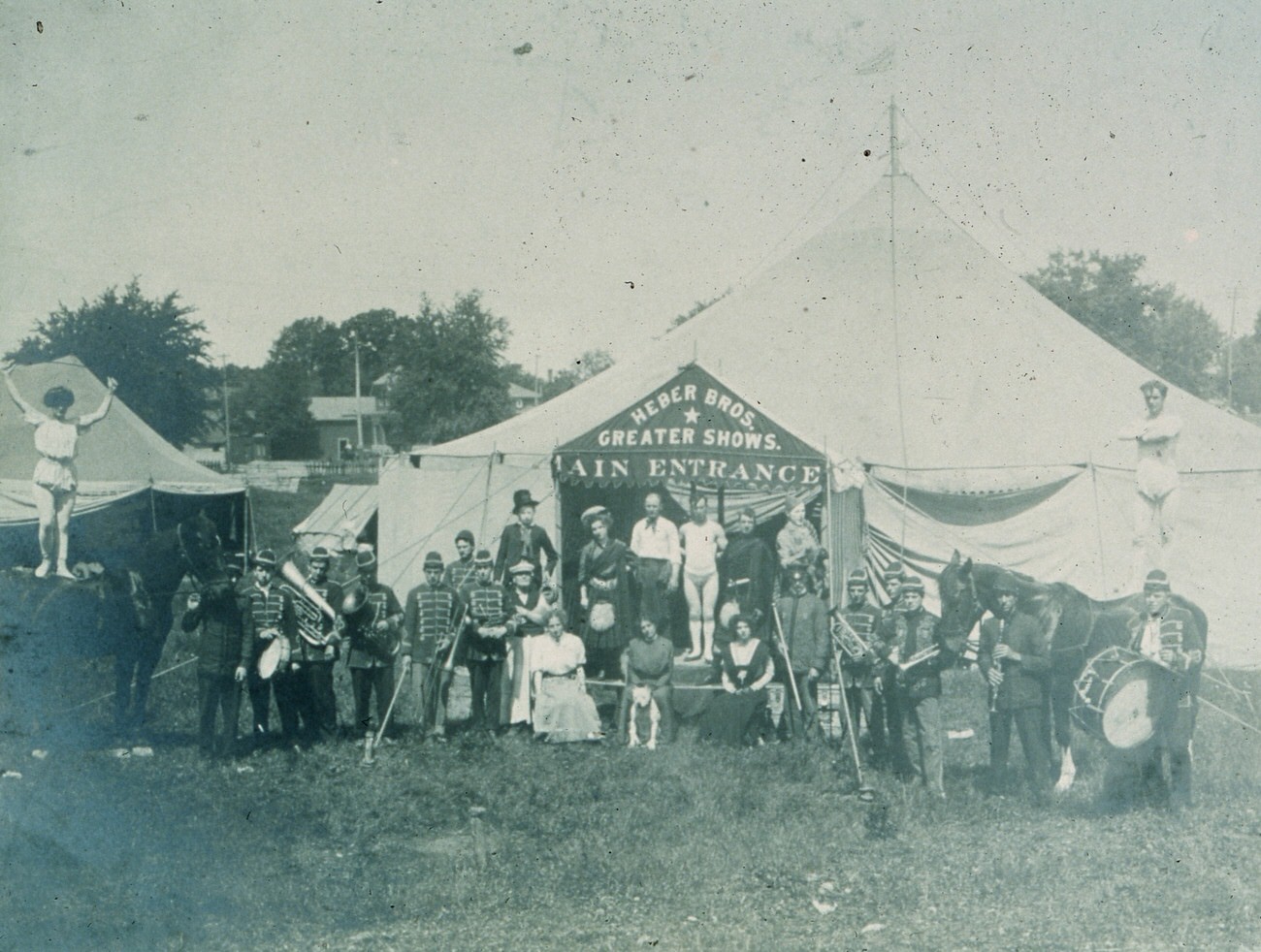 Heber Brother's Greater Show Circus tent with band and performers, including the Heber family members, 1907.