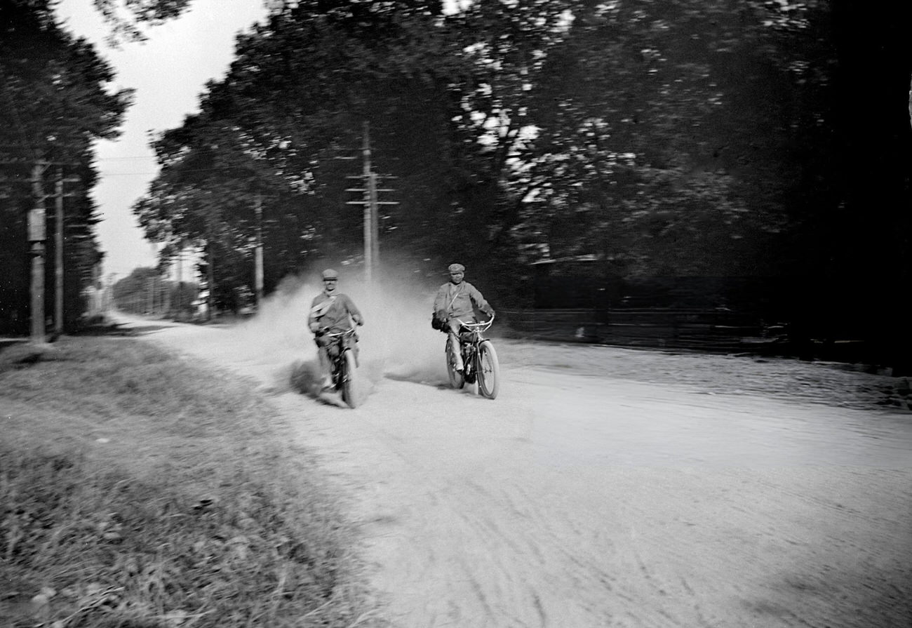 Two motorcyclists on a dirt road, Columbus, Ohio, circa 1910