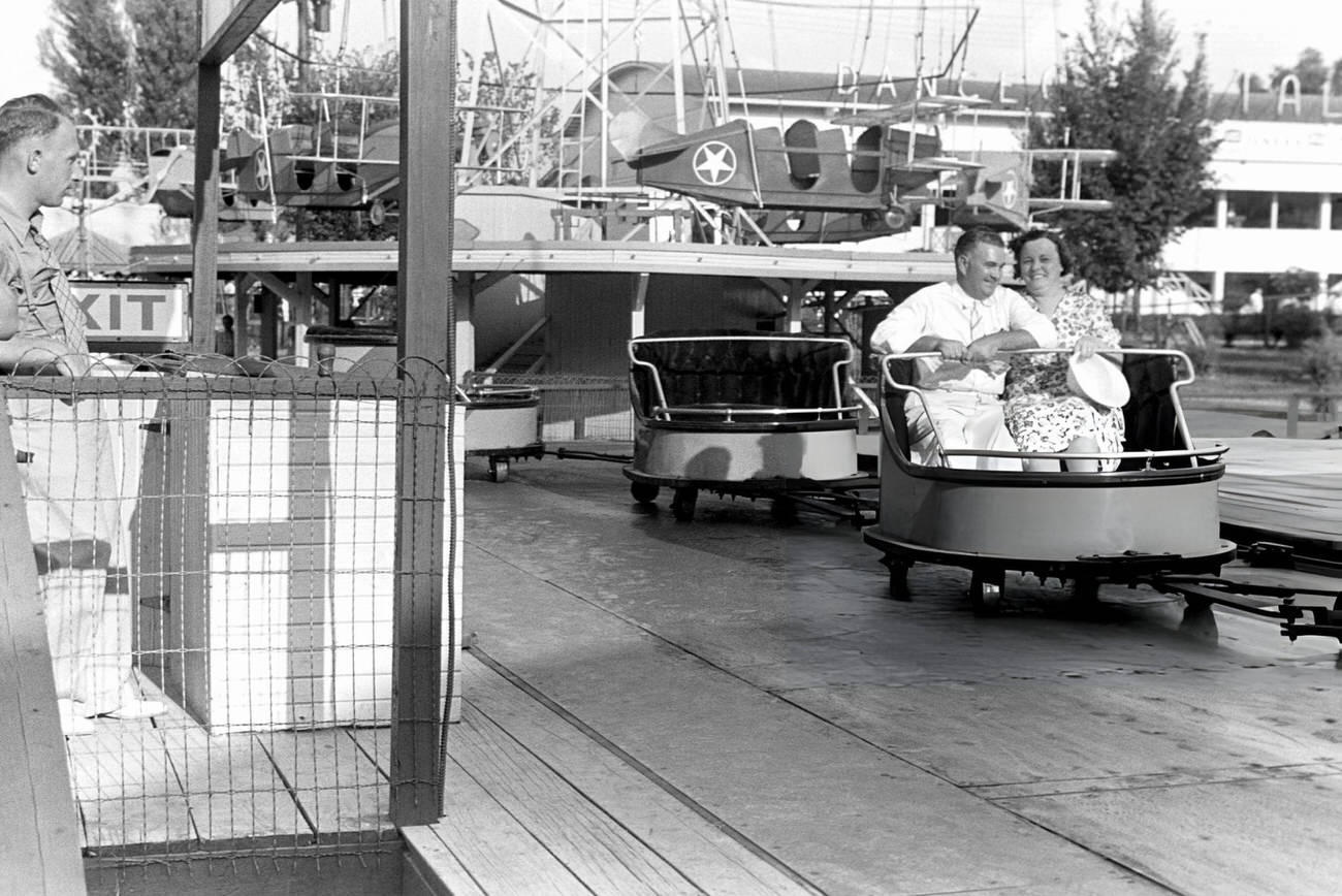 A couple enjoys a ride at Buckeye Lake Amusement Park near Columbus, Ohio, Summer 1938