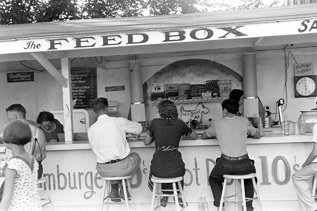 People eating at the Feed Box, a food stand at Buckeye Lake Amusement Park near Columbus, Ohio, Summer 1938