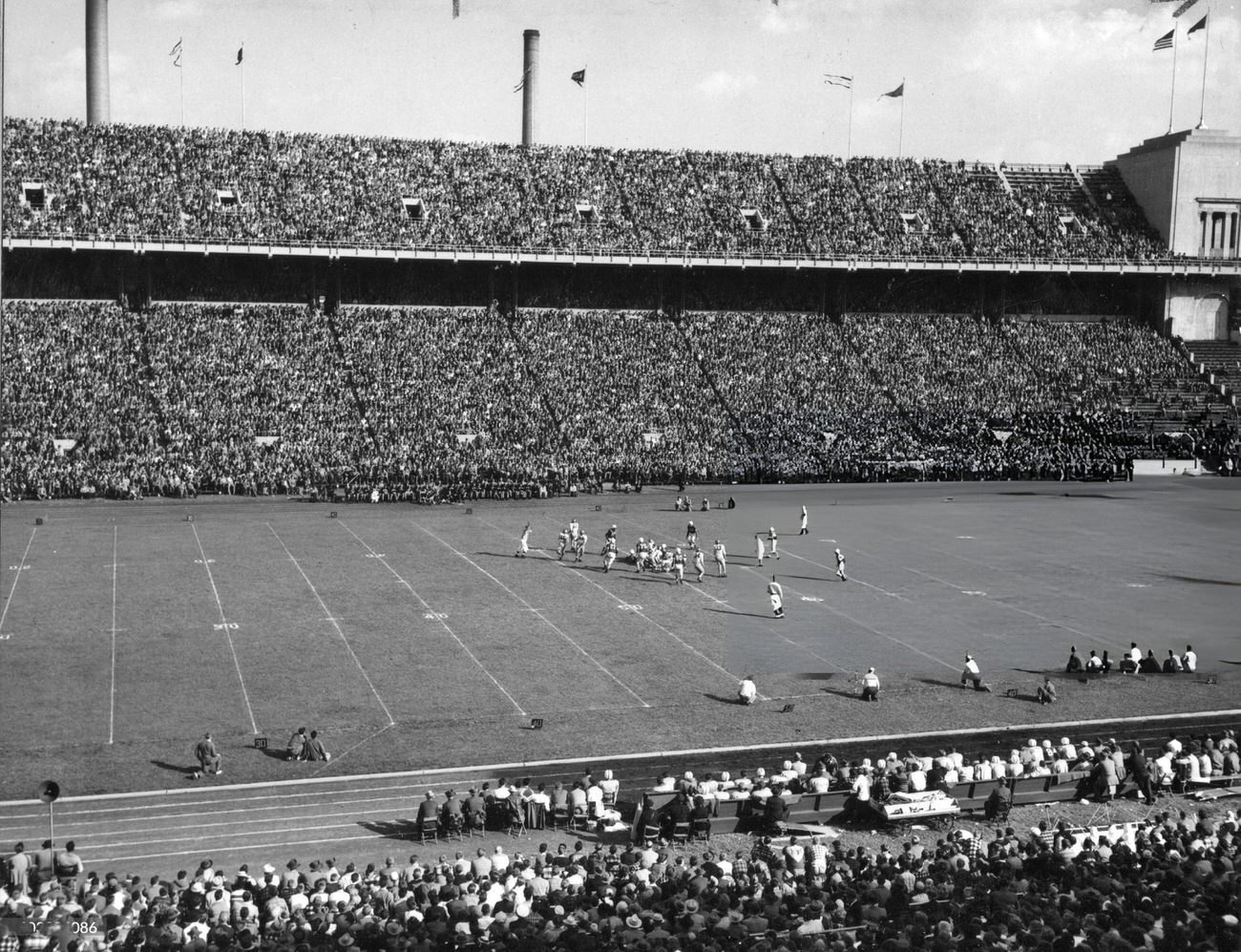 On-field action during a football game between Ohio State University and the University of Iowa at Ohio Stadium, Columbus, Ohio, 1948, with Iowa winning 14-7