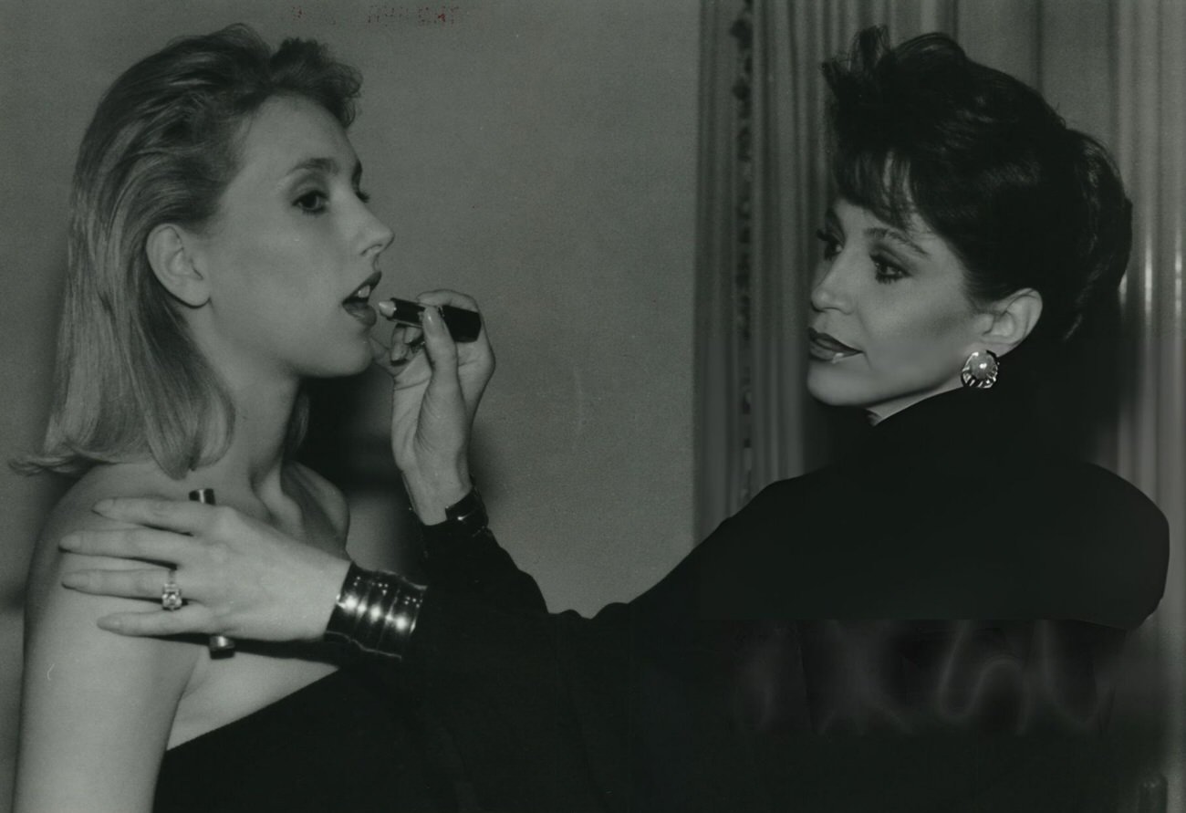 Adriana Banks applies makeup to models, Houston, Texas.