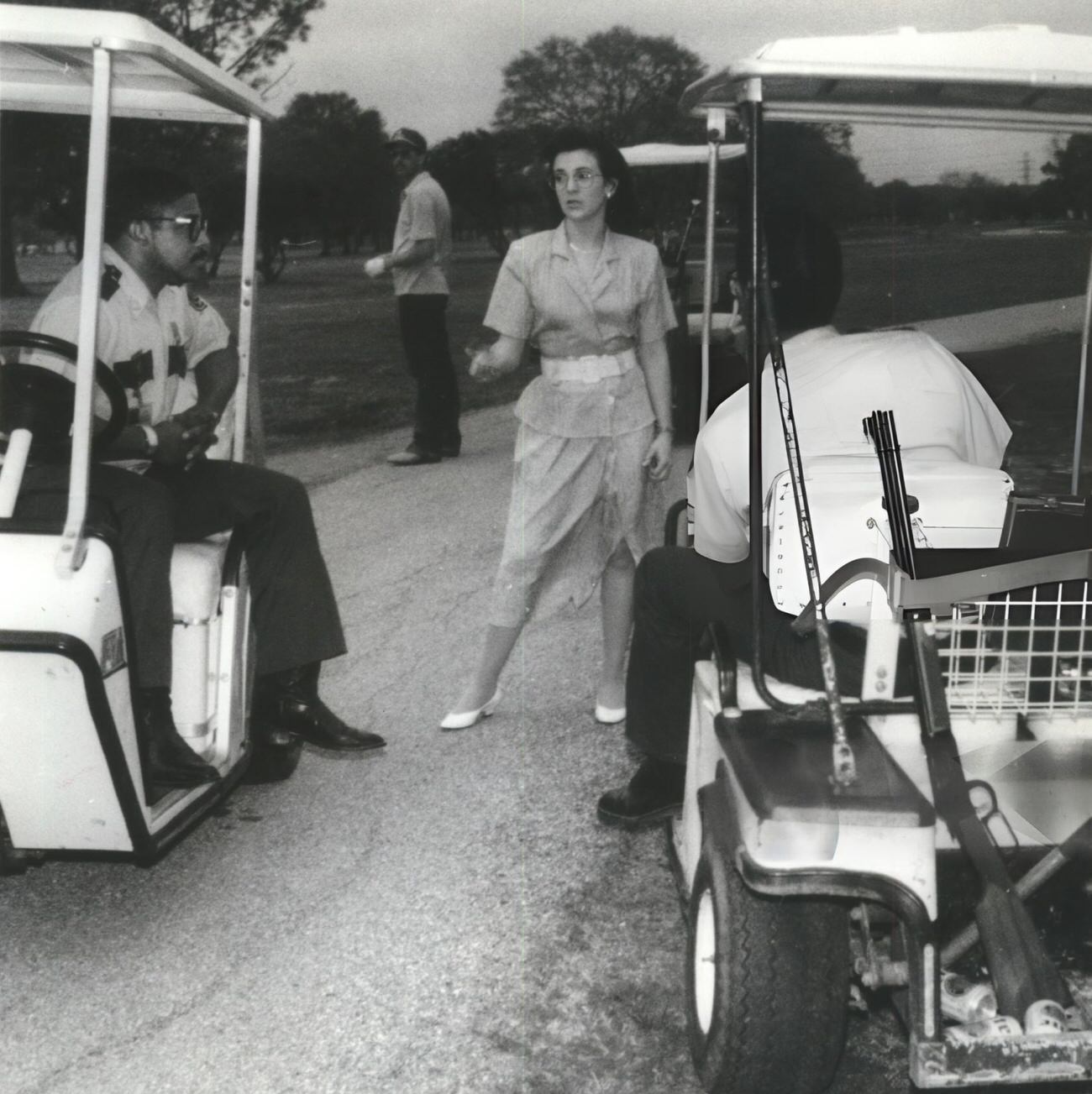Jon Fontenot attempts to dissuade animal control officers from shooting a coyote at the border of the Sharpstown Park Golf Course, Houston, Texas.