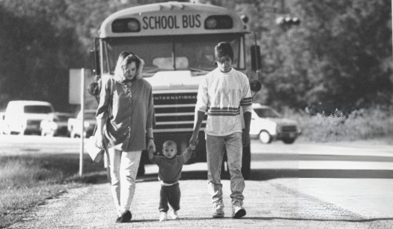 Fifteen-year-old mother Christy Pollard walks with her son Jonathan and boyfriend Johnny Rivera after school, highlighting young family dynamics.