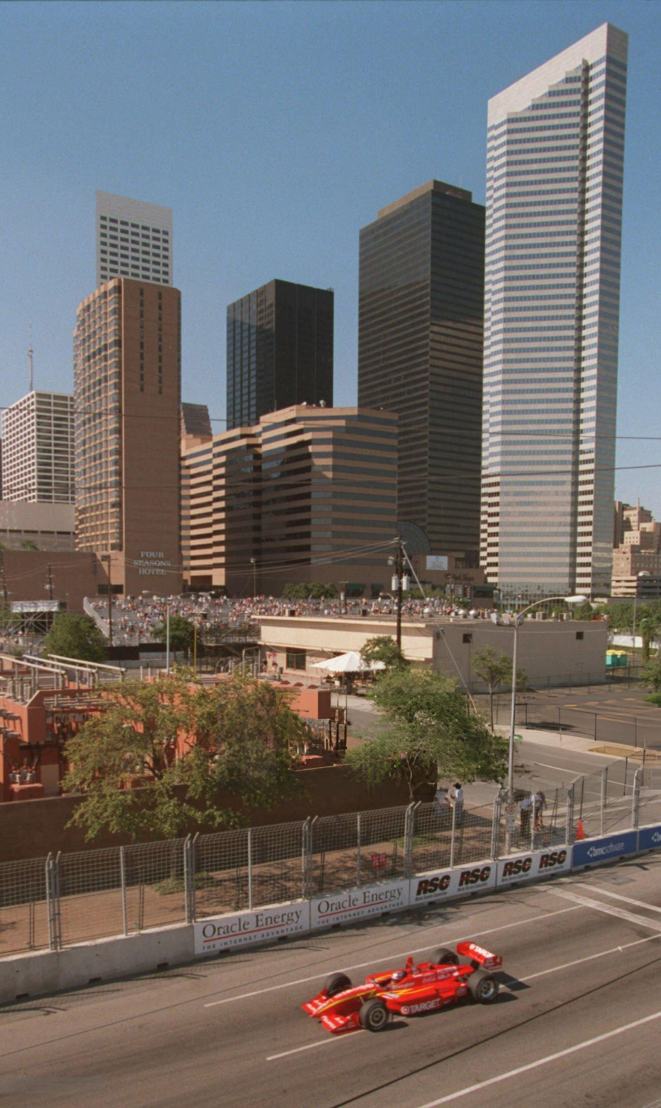 Juan Montoya races past the downtown skyline during CART qualifying, Houston, Texas, 1999.