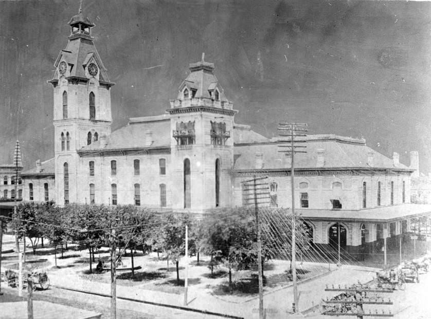 City Hall, Houston, Texas, showing grounds and telephone poles, 1880s