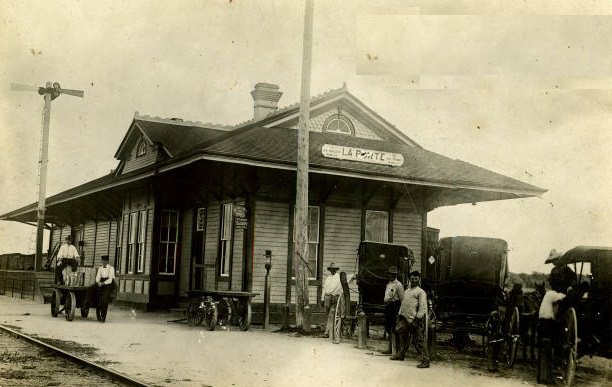 Men waiting at West Depot, 1880s
