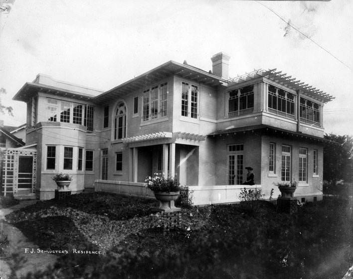 F. J. Schlueter Residence with a woman on patio, 1960s