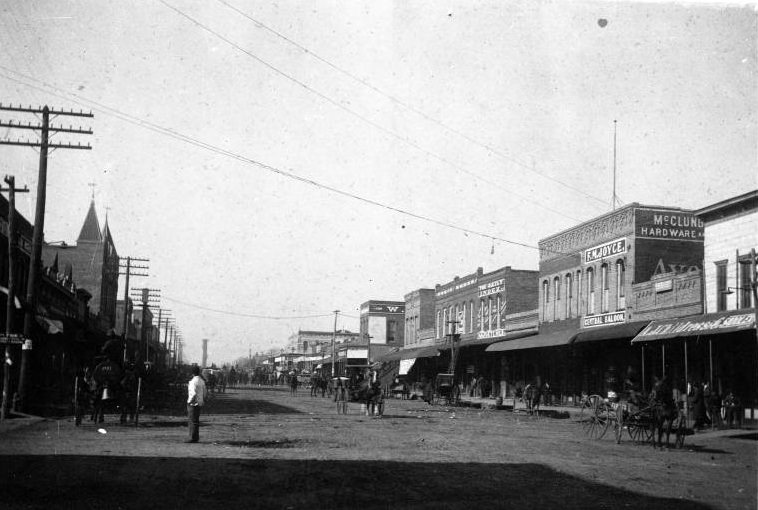 Main Street in Terrell with storefronts and carriages, 1896.