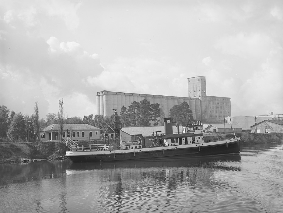 Flour mill and tugboat at the Port of Houston, Texas, 1939