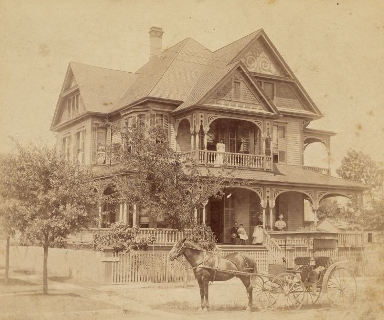 Ewing family home front view with Presley Kittredge and family, Houston, 1920s