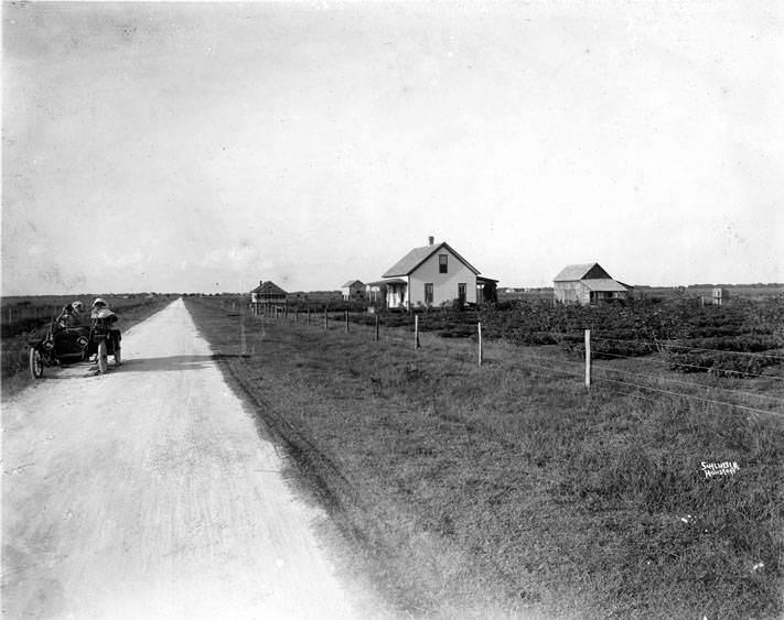 Rural scene with people in automobile, 1920s
