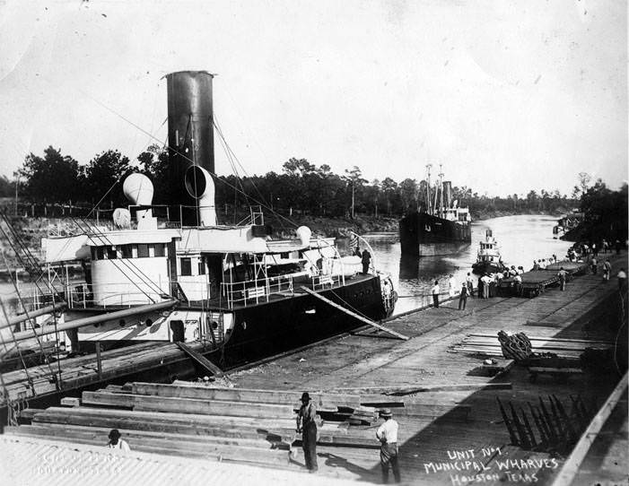 Men on municipal wharves beside Houston Ship Channel, 1890s