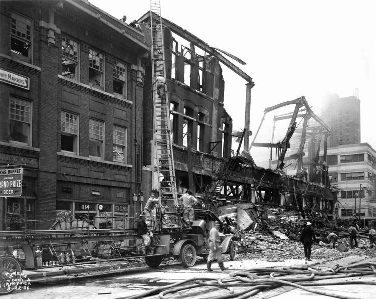 Firefighters at burned store, Houston, 1938.