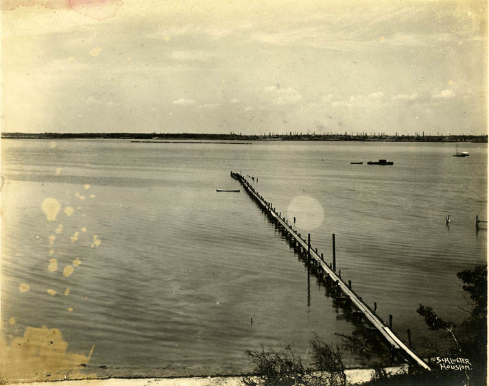 Pier into unidentified body of water, 1890s