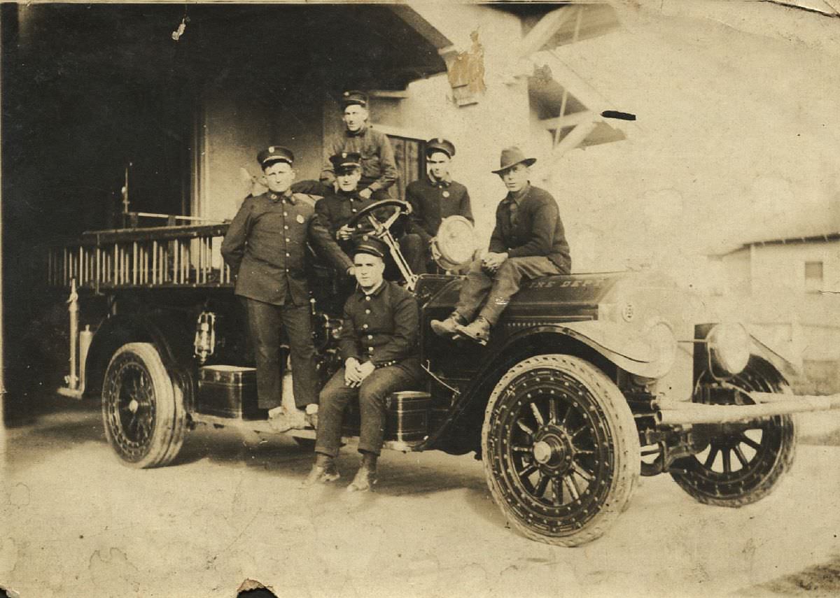 Firefighters of Station 12 on a fire engine, Vernon Dorsett far left, 1927.