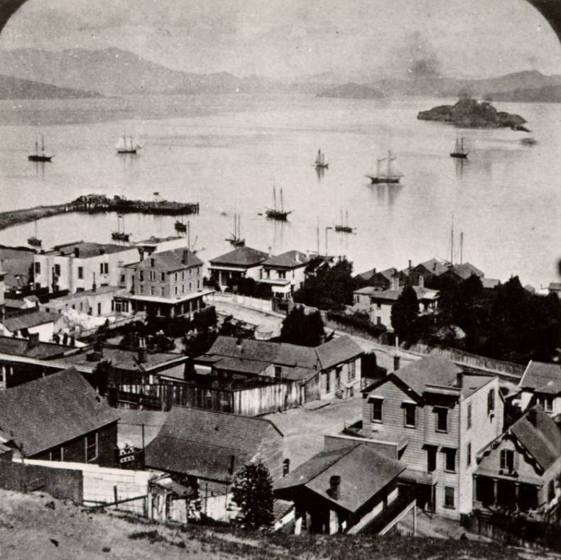 View of San Francisco waterfront from Telegraph Hill with Alcatraz Island in the distance, circa 1879