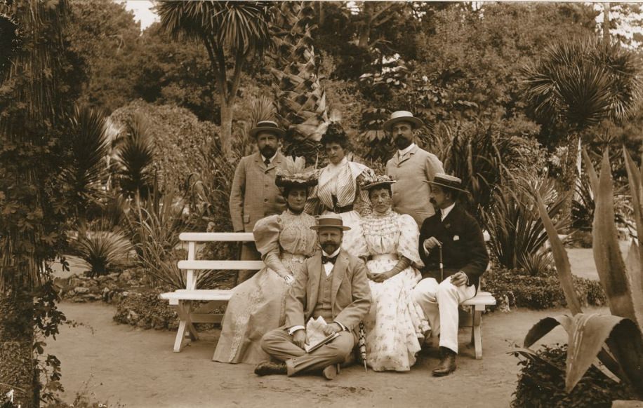 Unidentified group of people on a bench in Golden Gate Park, 1880s