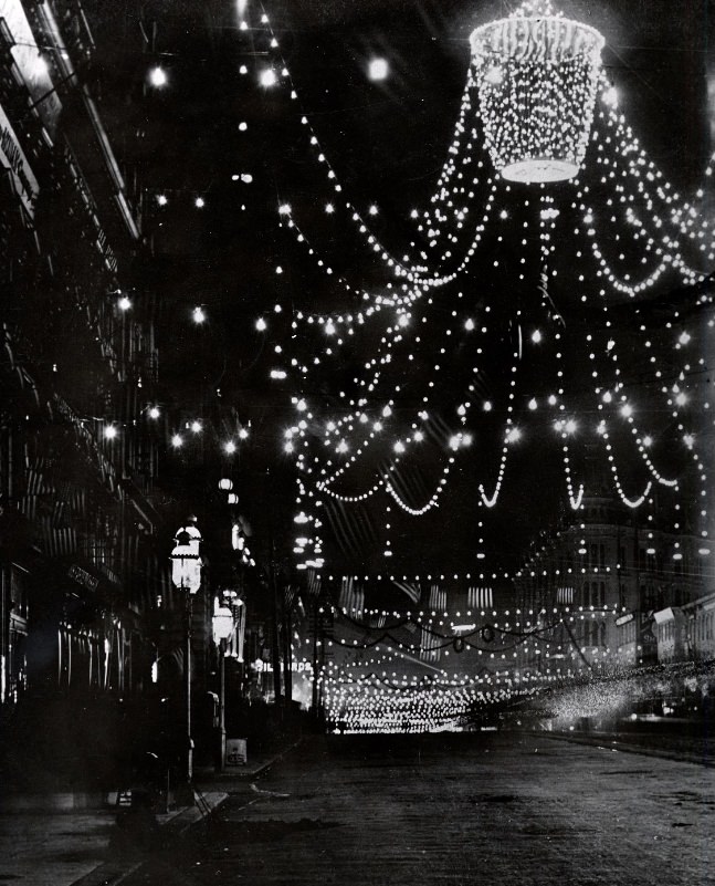 Market Street at night, decorated for the 50th anniversary celebration of the discovery of gold, 1898
