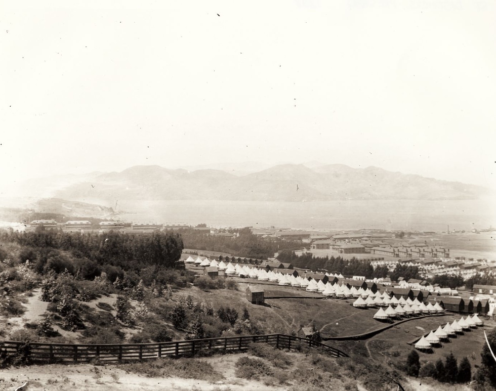 View of the Presidio, army barracks and tents, and San Francisco Bay in the background, 1898