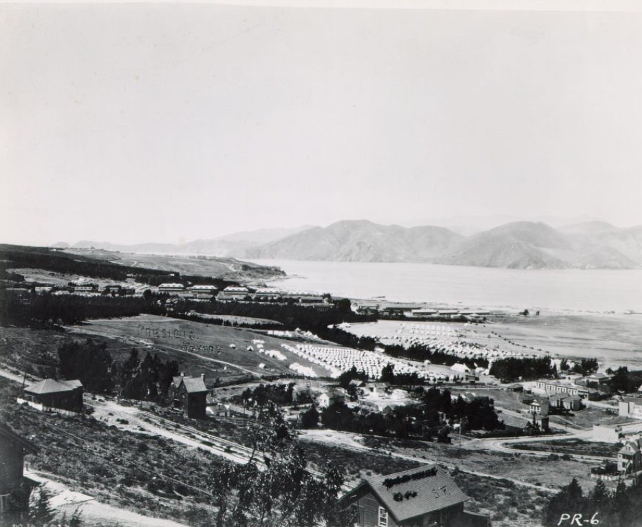 View of the Presidio, army barracks and tents, and San Francisco Bay in the background, 1899