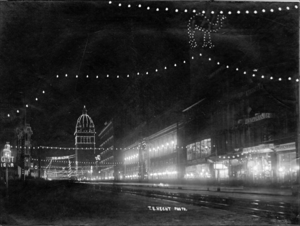 Nighttime view of illuminated decorations on Market Street, near 5th Street, circa 1902