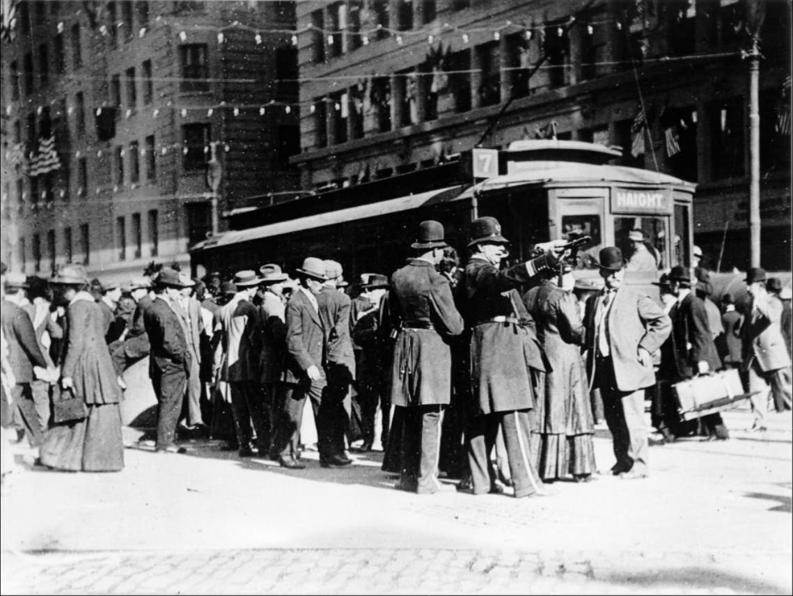 Crowd of people near streetcar at Market and Kearny streets, 1908