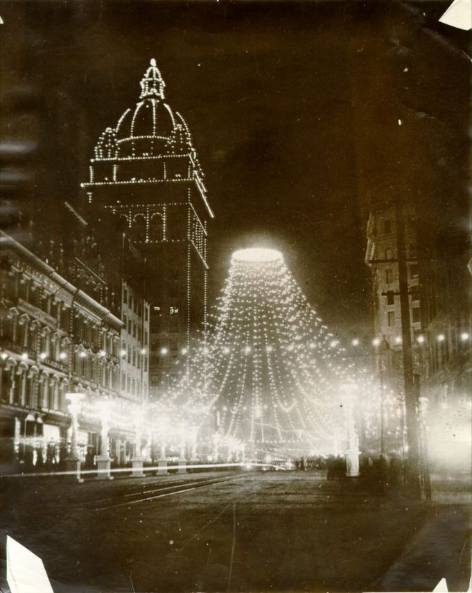 Nighttime view of Knights of Pythias decorations and Spreckels Building on Market Street, 1900