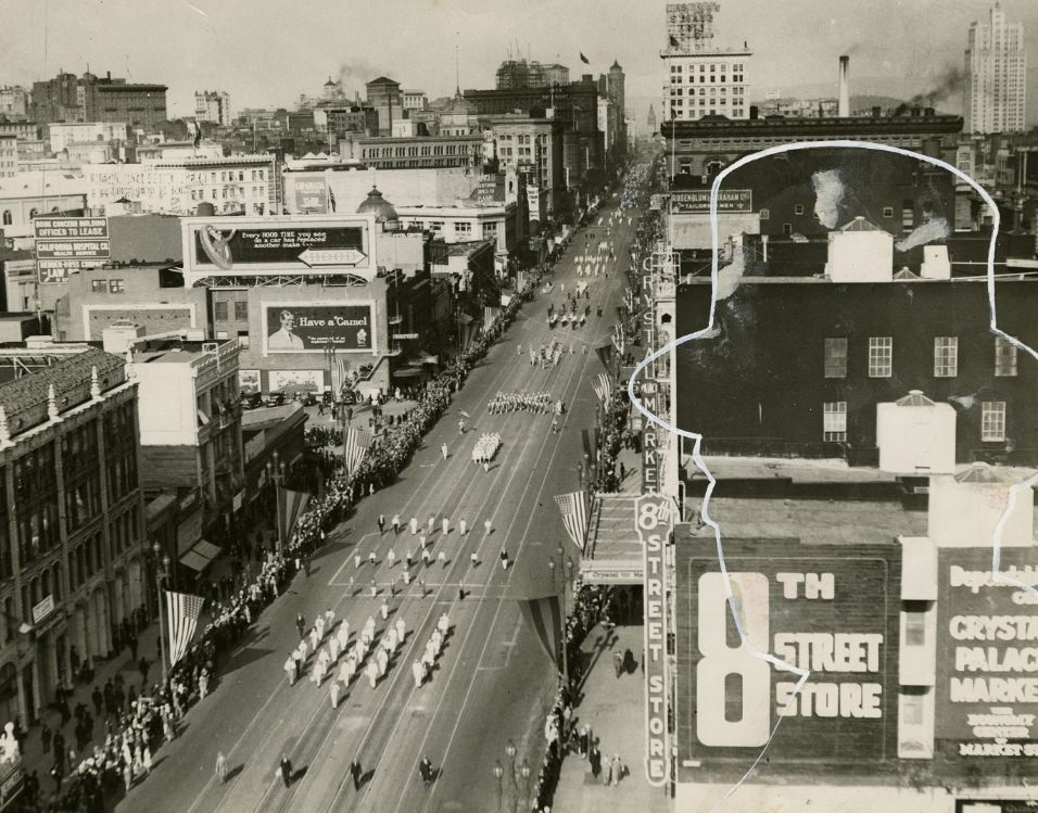 Panoramic view of Market Street during a parade in the 1920s.
